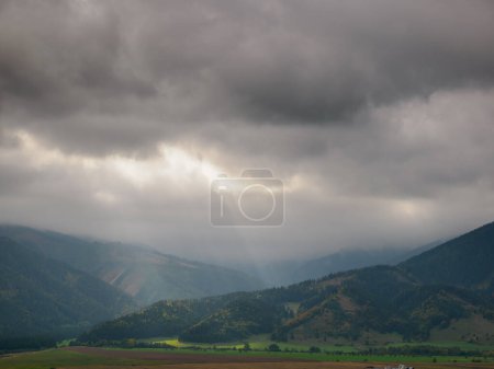 Photo for View of the Hoczanskie Mountains. In the foreground, a plowed farmland. Zilina Region. Liptowski Tarnowiec. Slovakia. - Royalty Free Image