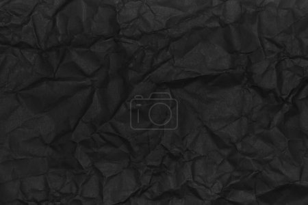Téléchargez les photos : Texture de papier froissé noir comme fond - en image libre de droit