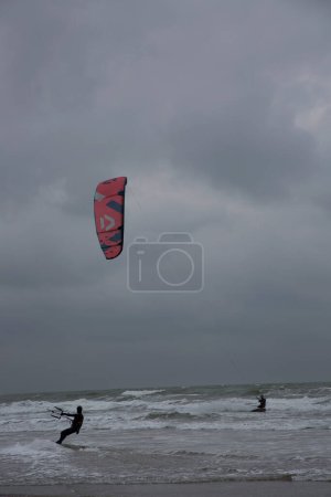Photo for People make windsurfing in the sea - Royalty Free Image
