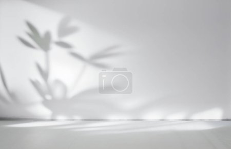 Photo for Blurred shadow from leaves plants on the white wall. Minimal abstract background for product presentation. Spring and summer. - Royalty Free Image
