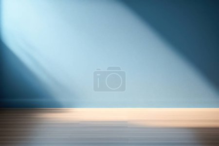 Photo for Beautiful versatile backdrop for design and product presentation with blue wall, light reflections and wooden floor. - Royalty Free Image