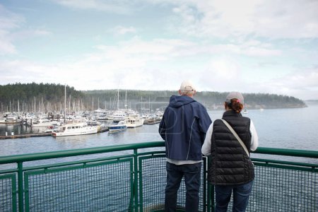Photo for Friday Harbor, Washington, United States - 09-11-2021: A view of people enjoying the open deck of a ferry boat. - Royalty Free Image