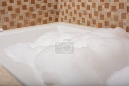 Photo for A view of a hot tub during a bubble bath session. - Royalty Free Image