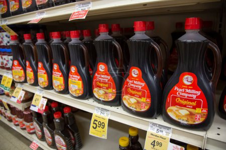 Photo for Los Angeles, California, United States - 05-20-2022: A view of several containers of Pearl Milling Company syrup, on display at a local grocery store. - Royalty Free Image