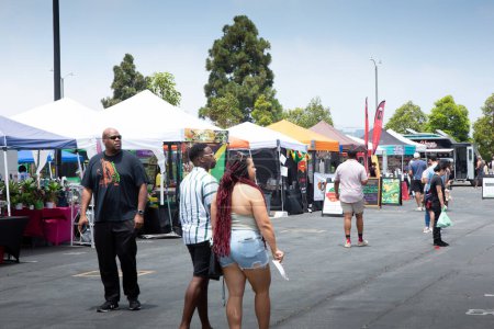 Photo for Los Angeles, California, United States - 05-20-2022: A view of people walking around the Spicy Green Book Food Market. - Royalty Free Image
