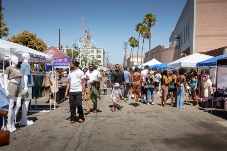 Photo for Los Angeles, California, United States - 05-20-2022: A view of people walking around the Black on the Block festival. - Royalty Free Image