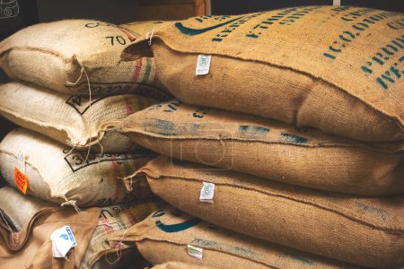 Photo for Los Angeles, California, United States - 03-03-2019: A view of stacks of burlap coffee bean sacks, seen at a local coffee roastery. - Royalty Free Image