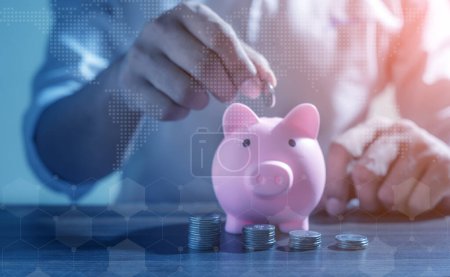 Photo for Save money and account banking for finance concept, Piggy bank with coin on blurred background, Save Monney for Investors Using Internet to Trade Stocks or Trade Fund - Royalty Free Image