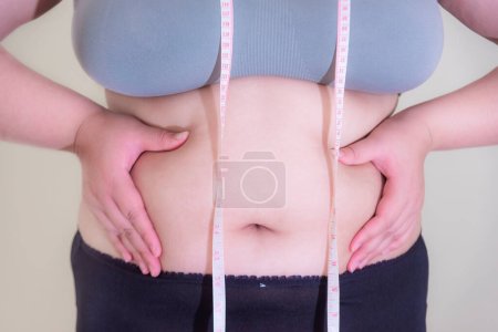 Photo for Fat woman, Shape up healthy stomach muscle, and diet lifestyle, to reduce belly concept. - Royalty Free Image