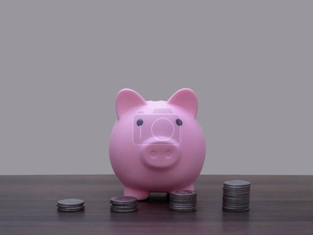 Photo for Save money and account banking for finance concept, Piggy bank with coin on blurred background, Save Monney for Investors Using Internet to Trade Stocks or Trade Fund - Royalty Free Image