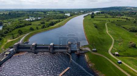 Photo for O'Brien's Bridge water dam, Clare Ireland -May,28, 2022,Parteen Weir in the headrace canal to Ardnacrusha Power Station - Royalty Free Image