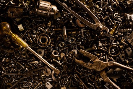 Photo for Background of bolts, nuts, screws, washers and metal tools - Royalty Free Image
