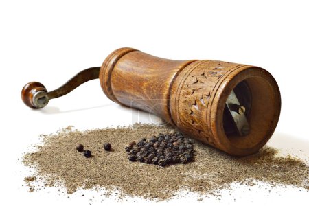 Photo for Wooden grinder for grinding black pepper and peppercorns isolated on white background - Royalty Free Image