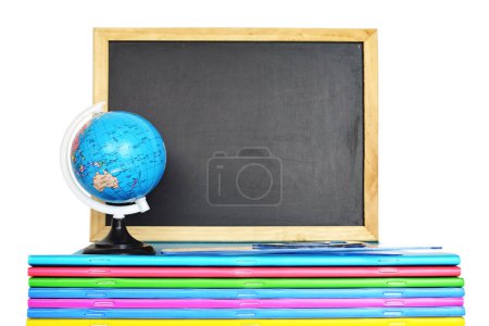 Photo for Back to school concept. Blackboard and globe on stack of colorful copybooks - Royalty Free Image