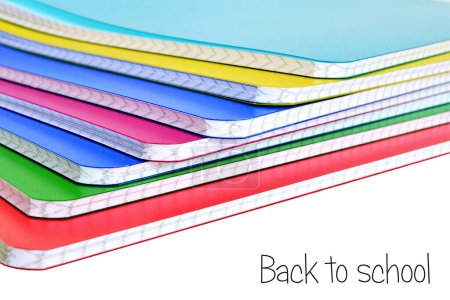 Photo for Stack of colorful copybooks on white background - Royalty Free Image