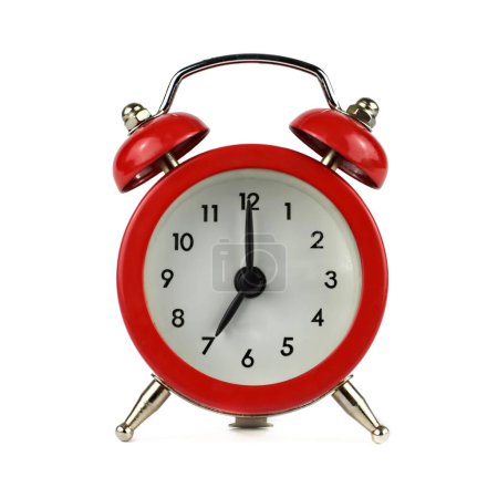 Foto de Reloj despertador que muestra siete en punto aislado sobre fondo blanco - Imagen libre de derechos