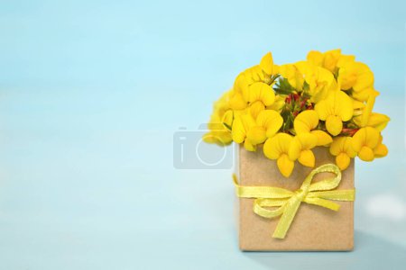 Photo for Yellow Flowers arranged in gift box, copy space - Royalty Free Image