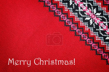 Foto de Feliz Navidad fondo de jersey de punto rojo con patrón de invierno - Imagen libre de derechos