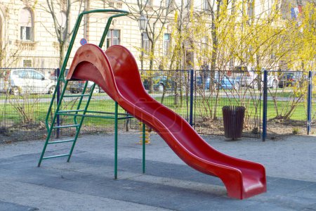 Photo for Red Children's slide at the playground - Royalty Free Image
