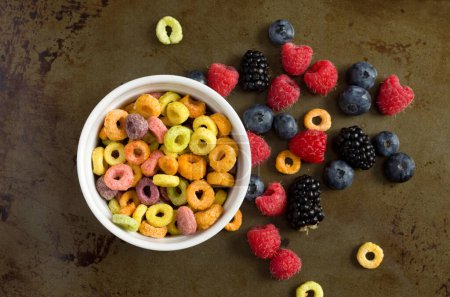Photo for Top View of Colorful Cereal with Raspberries, Blueberries and Blackberries Horizontal - Royalty Free Image