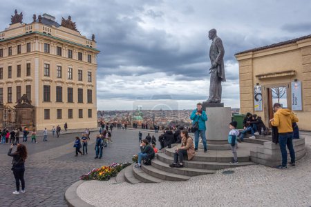 Photo for Prague, Czechia - 03.24.2023: People gathering on Prague Castle Square under the statue of former president Tomas Garrigue Masaryk. Cloudy day of spring - Royalty Free Image