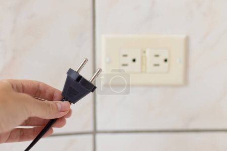 Photo for Power cable doesnt feet to the electrical plug type B. Closeup, selective focus. - Royalty Free Image