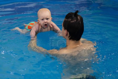 Baby coughing after drinking water from swimming pool. Disinfection and cleaning of swimming pool