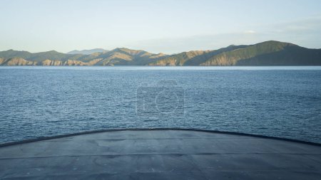 View of the bow of big transport ship approaching the land during sail, New Zealand.