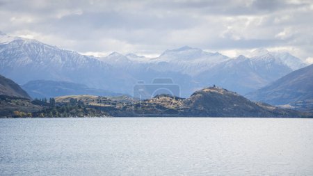 Photo for Landscape panorama with lake and hills and big snowy mountains in backdrop, New Zealand. - Royalty Free Image