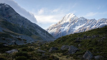 Dominant snowy mountain with glaciers catching last light of the day, Mt Cook, New Zealand.