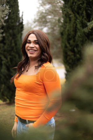 Vertical portrait of trans woman smiling cheerfully to the camera. High quality photo