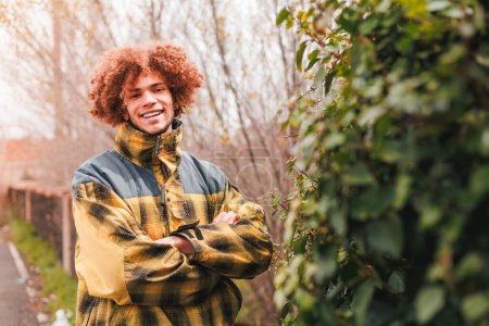 Curly hair male portrait in nature. High quality photo