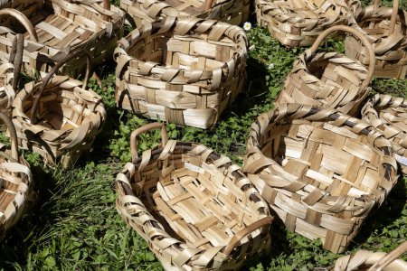 A display of handmade wicker baskets for sale at market