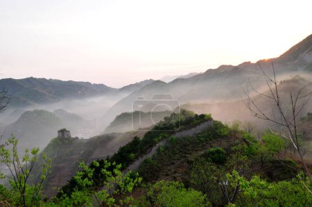 The ancient Great Wall and the early morning mist 