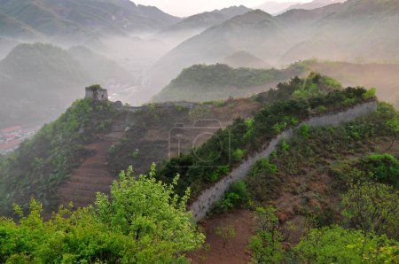 The ancient Great Wall and the early morning mist 