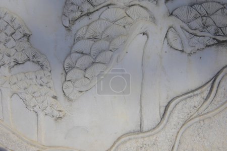 Vintage ornament on the stone. Close-up seamless texture. Stone texture. Pattern on the stone. Embossed pattern.