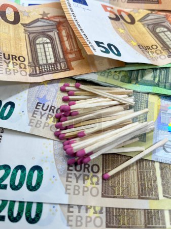 Photo for Close-up of matchsticks on EURO banknotes. 200 EUR 50 EUR - Royalty Free Image