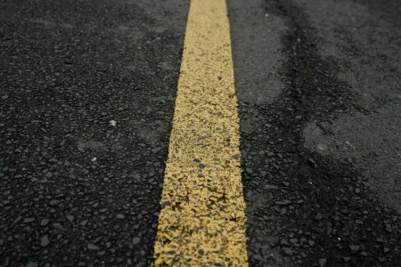 Photo for Yellow line on road texture on a street - Royalty Free Image