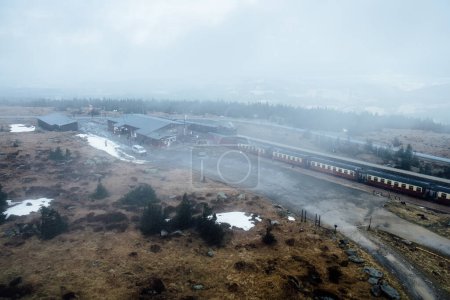 Photo for Train in a foggy winter mountains - Royalty Free Image