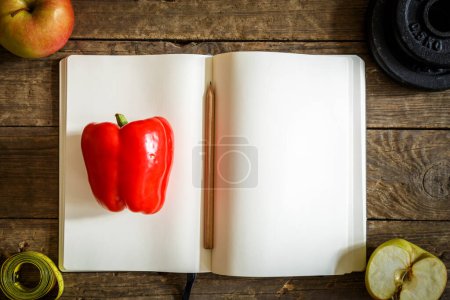Photo for Red pepper and book - Royalty Free Image