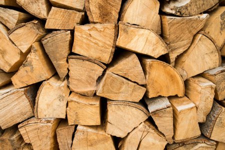 Photo for Firewood on wood background - Royalty Free Image