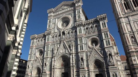 Photo for Florence, Italy, seen from below. Details of the cathedral and Giotto's bell tower. View of the Basilica of Santa Maria del Fiore. - Royalty Free Image