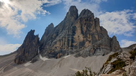 Photo for A close up view on Italian Dolomites. There are many high and sharp peak in front, with many landslides. Dangerous climbing. Barely any plants growing in the  area. Raw and unspoiled landscape - Royalty Free Image
