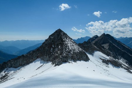 Photo for A panoramic view on a glacier, in the nearby of Hohe Sonnblick in Austrian Alps. The high and steep peaks are very sharp. Many mountain chains in the nearby. Clear and sunny day. Mountainerring - Royalty Free Image
