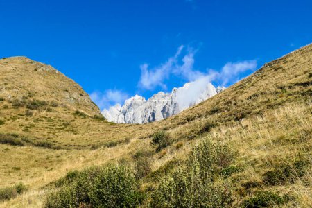 Photo for A golden colored mountains range at the Austrian-Italian border. The autumn vibes in Alps, nature getting ready for hibernation. Sharp, rocky Alpine peaks in the back. Serenity and solitude - Royalty Free Image