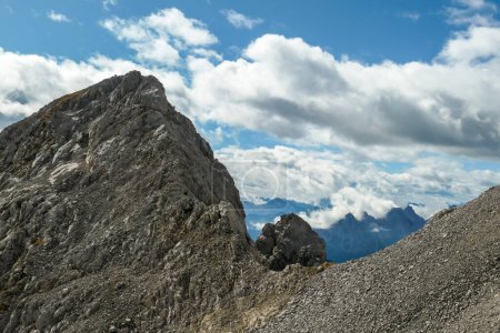 Photo for A close up shot of a massive mountain range in Austrian Alps. The rocky mountain looks inaccessible. High Alpine mountaineering. There is overcast. Sharp and steep slopes of the Alpine massive. - Royalty Free Image