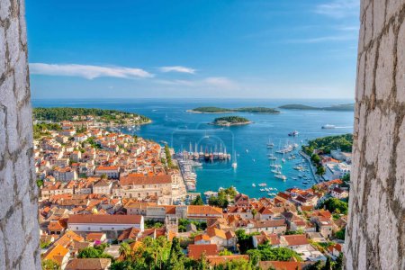 Photo for The picturesque Dalmatian coast resort town of Hvar, Croatia, viewed from the 13th century fortress on the hill above. - Royalty Free Image