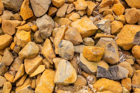 Photo for Background with dark stones with yellowish dust - Royalty Free Image