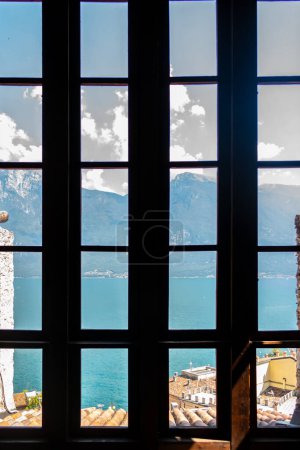 Photo for View on Garda lake from a window of Limone castle, Brescia, Italy - Royalty Free Image