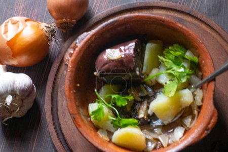 Food , Pot with boiled potatos , black sausage , onion , garlic , parsley